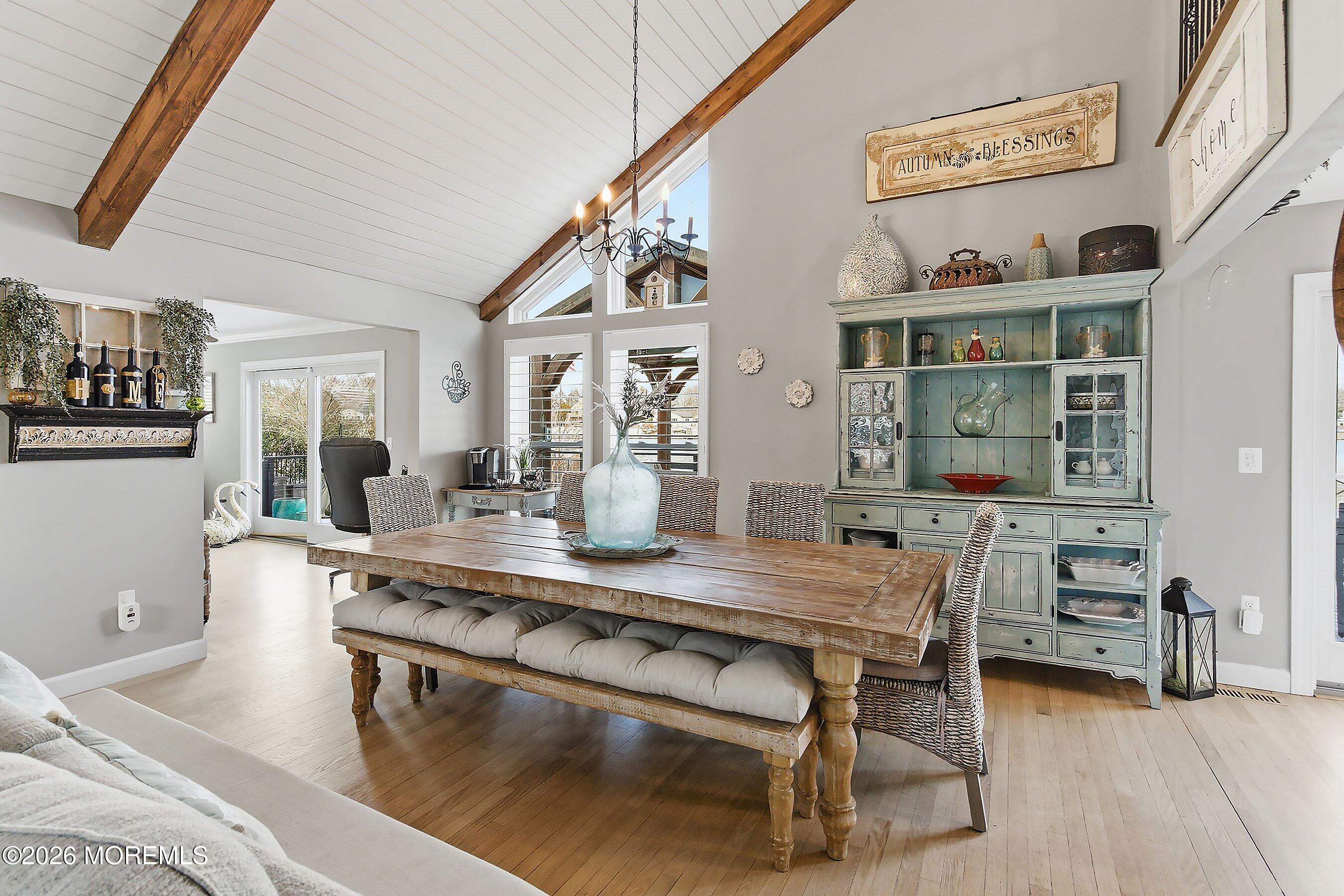 261 Timberlake Drive Manahawkin, NJ 08050 - Photo 14 of 64 a dining hall with stainless steel appliances granite countertop a stove and a dining table with wooden floor