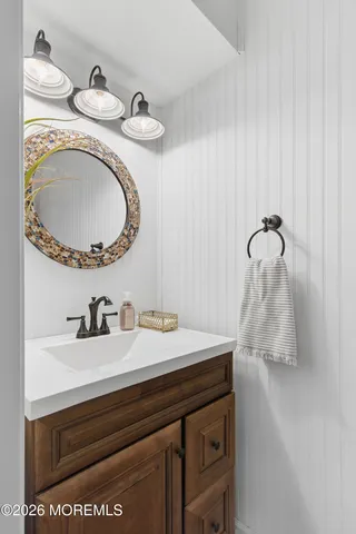 a bathroom with a shower and a mirror