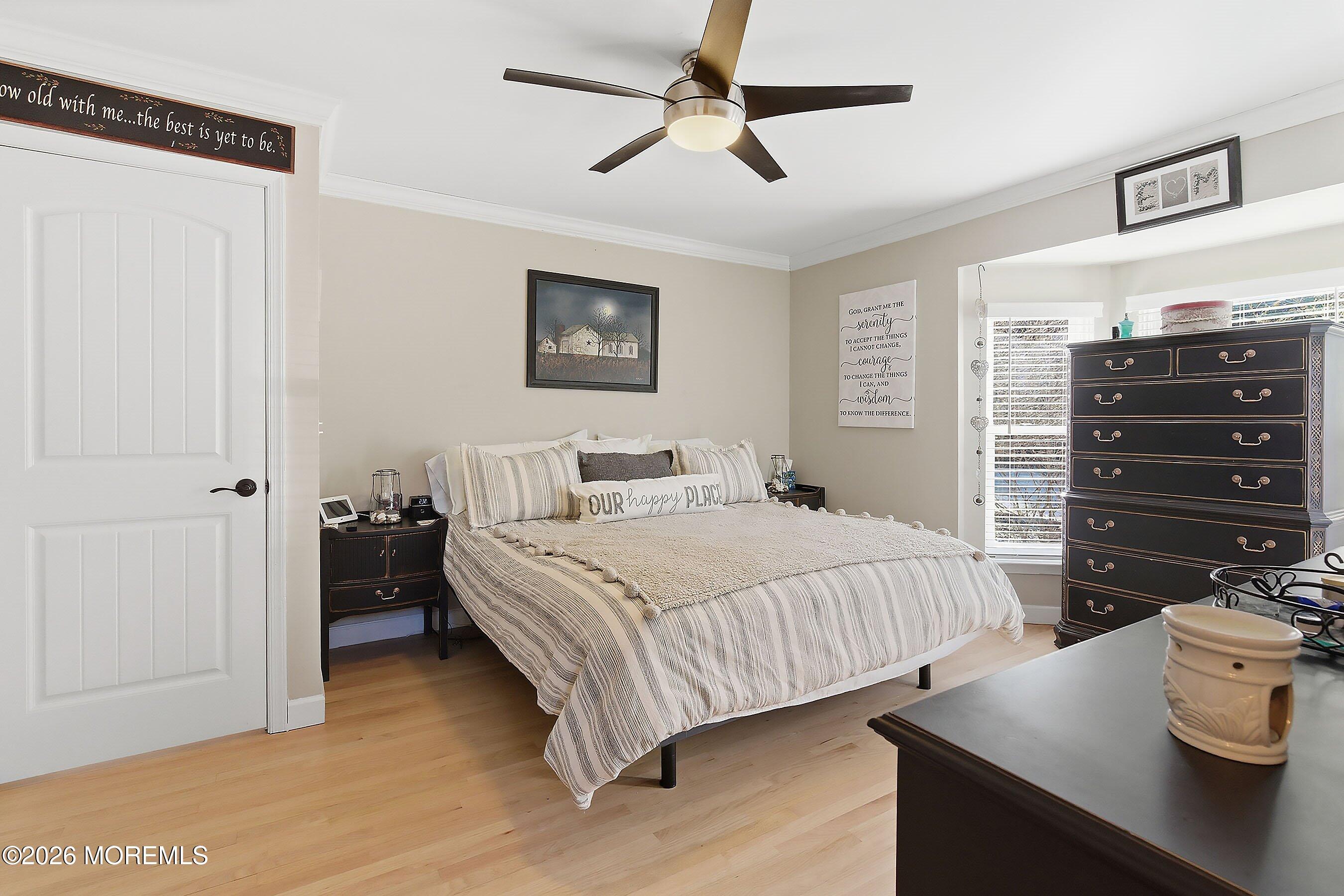 261 Timberlake Drive Manahawkin, NJ 08050 - Photo 23 of 64 a bedroom with a bed and a dresser