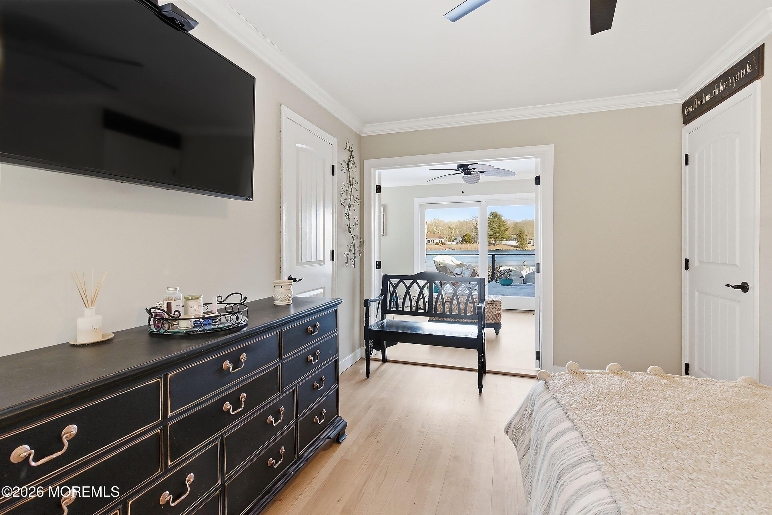 261 Timberlake Drive Manahawkin, NJ 08050 - Photo 24 of 64 a bedroom with a bed and flat screen tv