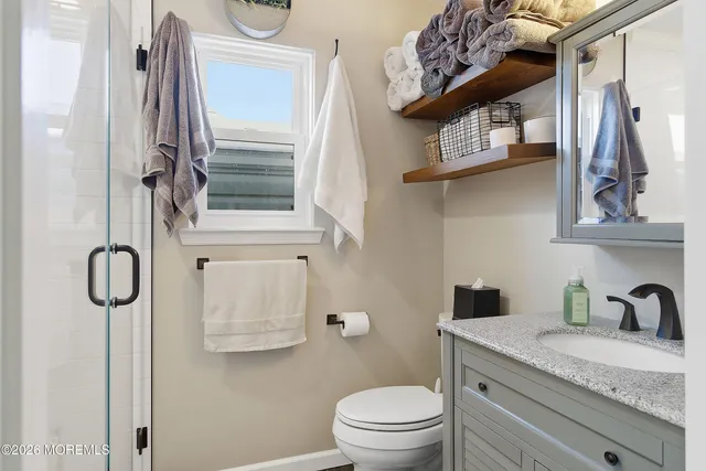 a view of entryway livingroom and hall with wooden floor