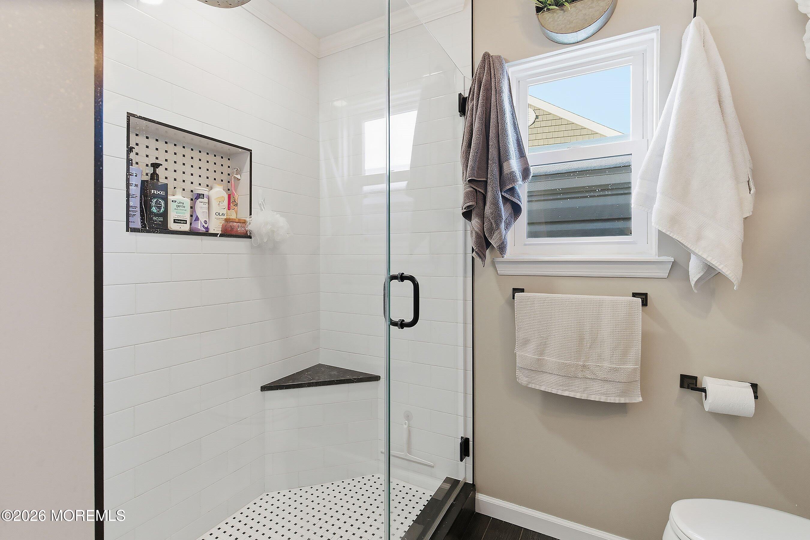 261 Timberlake Drive Manahawkin, NJ 08050 - Photo 25 of 64 a bathroom with a shower and a mirror