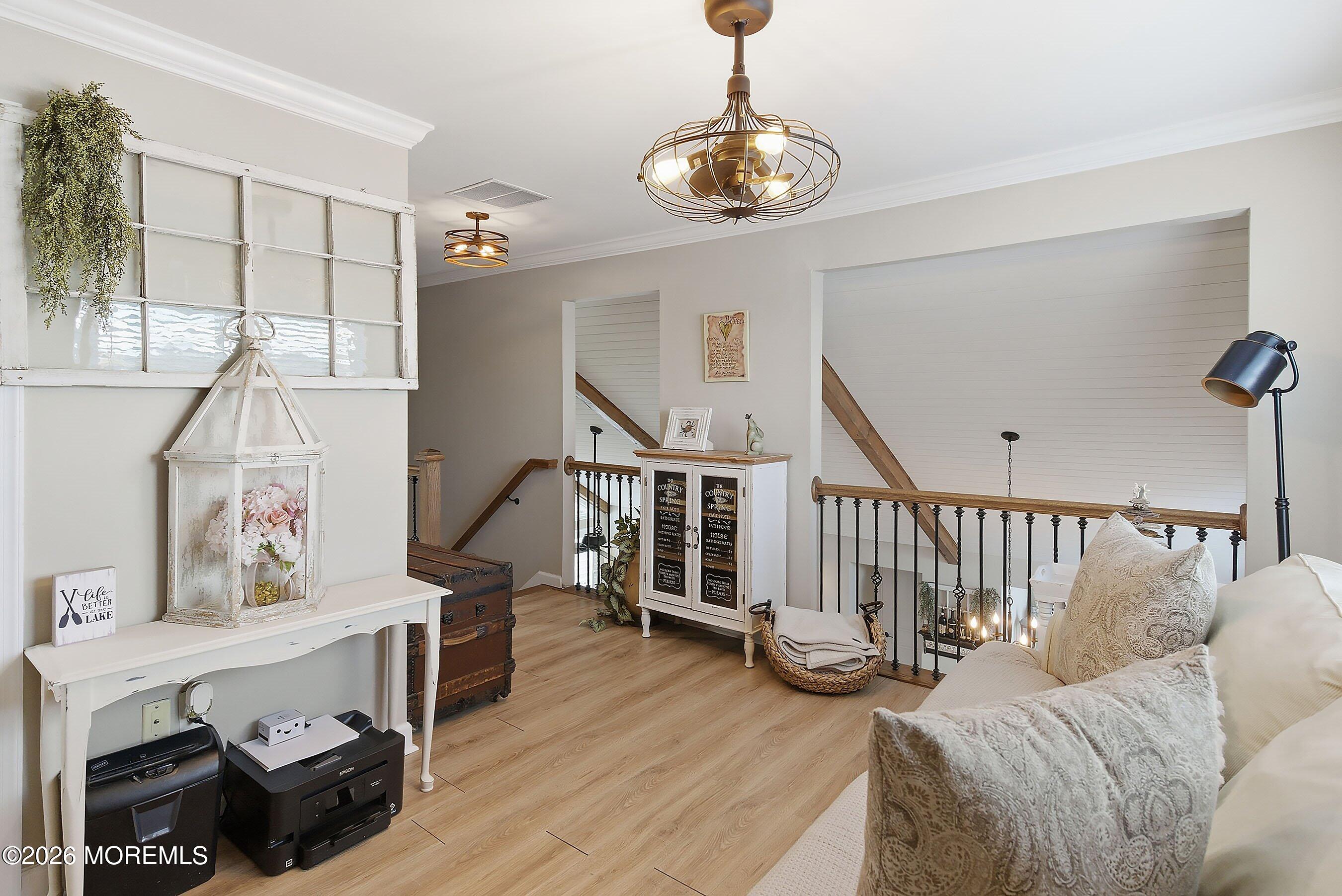 261 Timberlake Drive Manahawkin, NJ 08050 - Photo 29 of 64 a view of entryway livingroom and hall with wooden floor