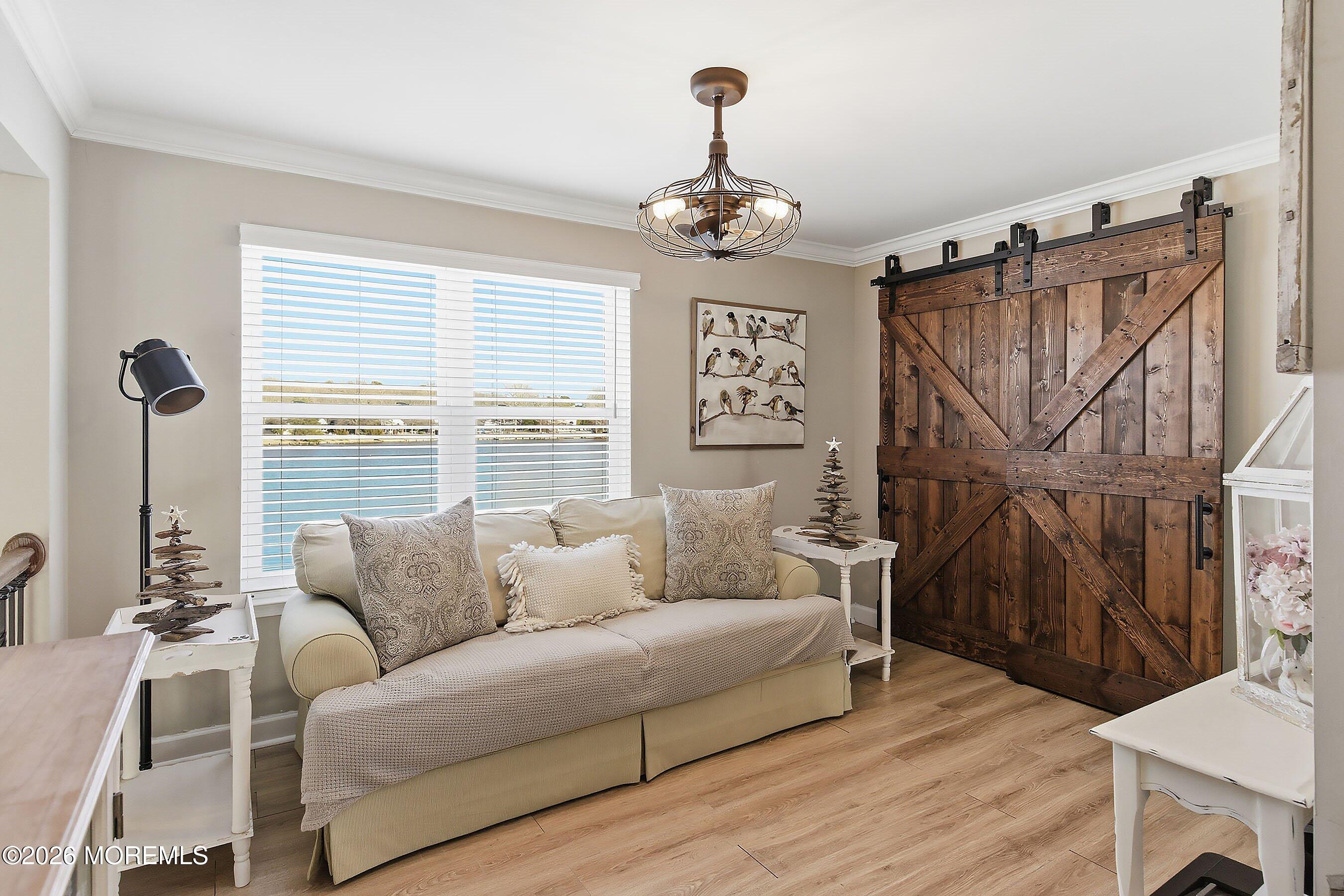 261 Timberlake Drive Manahawkin, NJ 08050 - Photo 30 of 64 a living room with furniture and a wooden floor