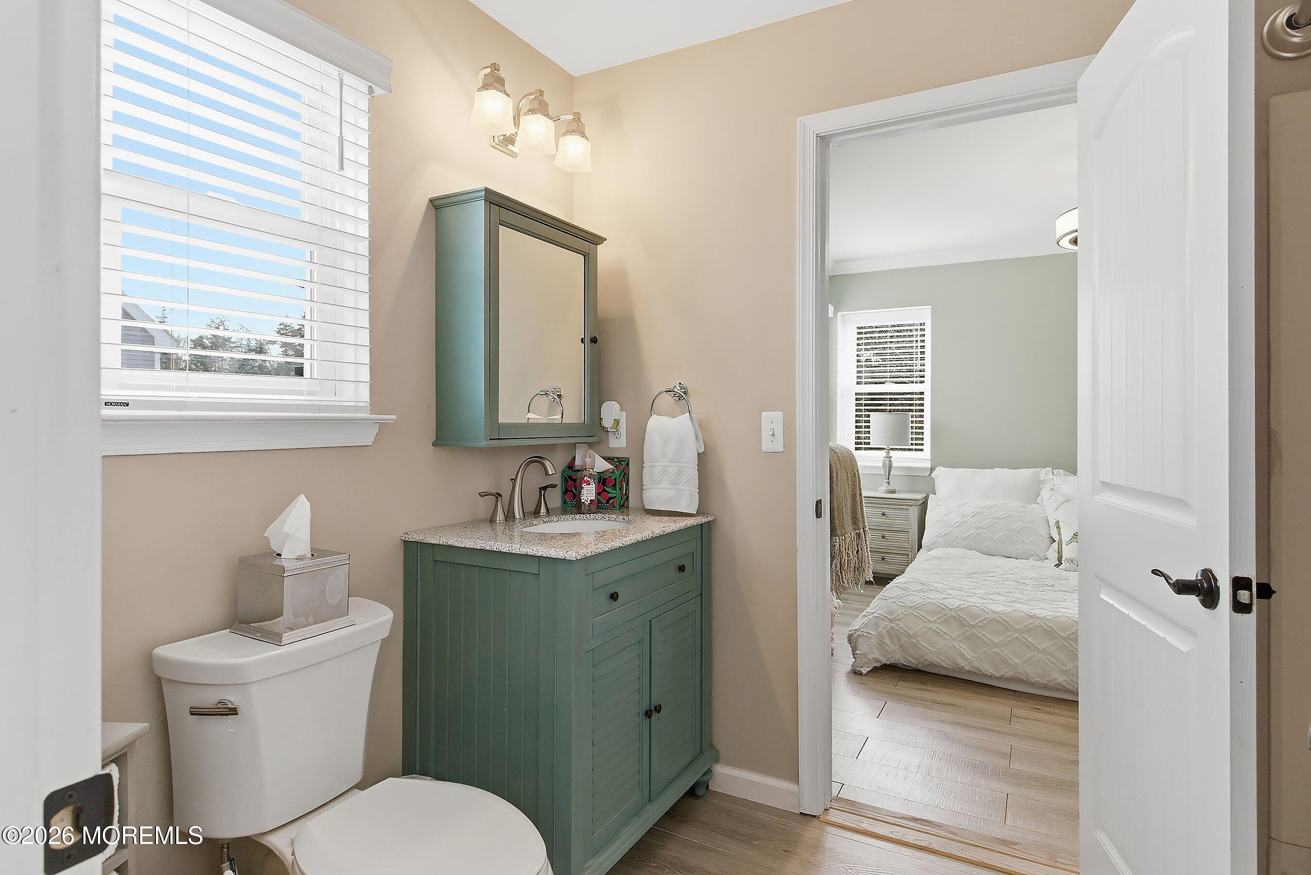 261 Timberlake Drive Manahawkin, NJ 08050 - Photo 33 of 64 a en suite bathroom with a toilet sink and mirror