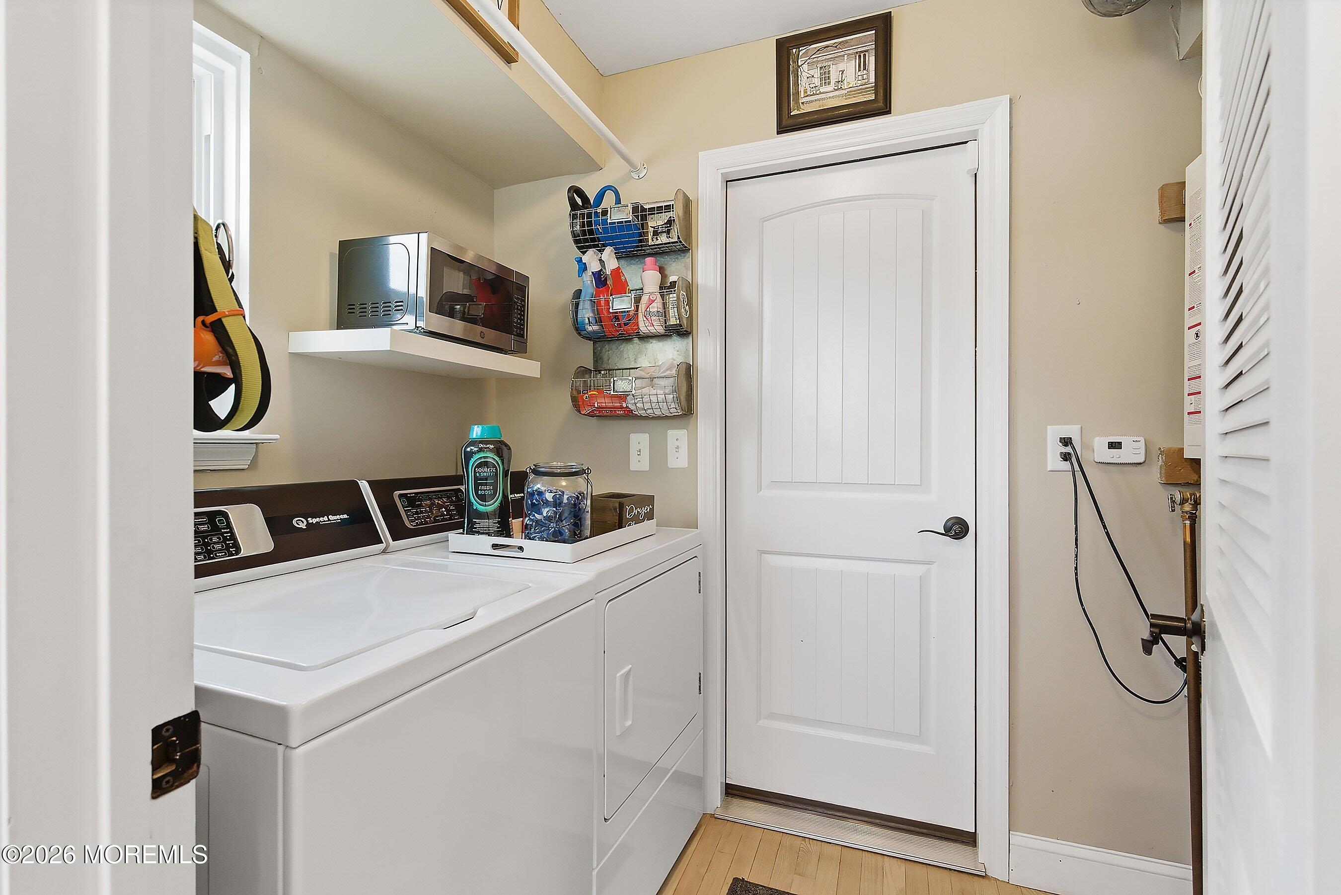 261 Timberlake Drive Manahawkin, NJ 08050 - Photo 34 of 64 a utility room with dryer and washer