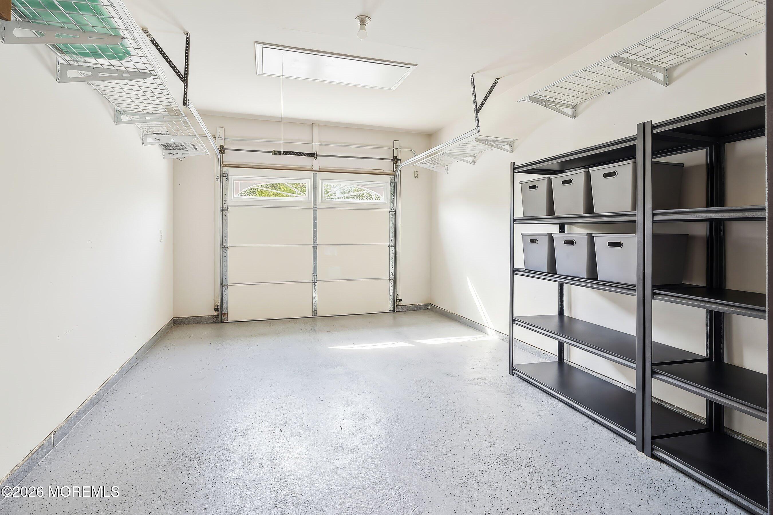 261 Timberlake Drive Manahawkin, NJ 08050 - Photo 35 of 64 a view of a garage with stairs