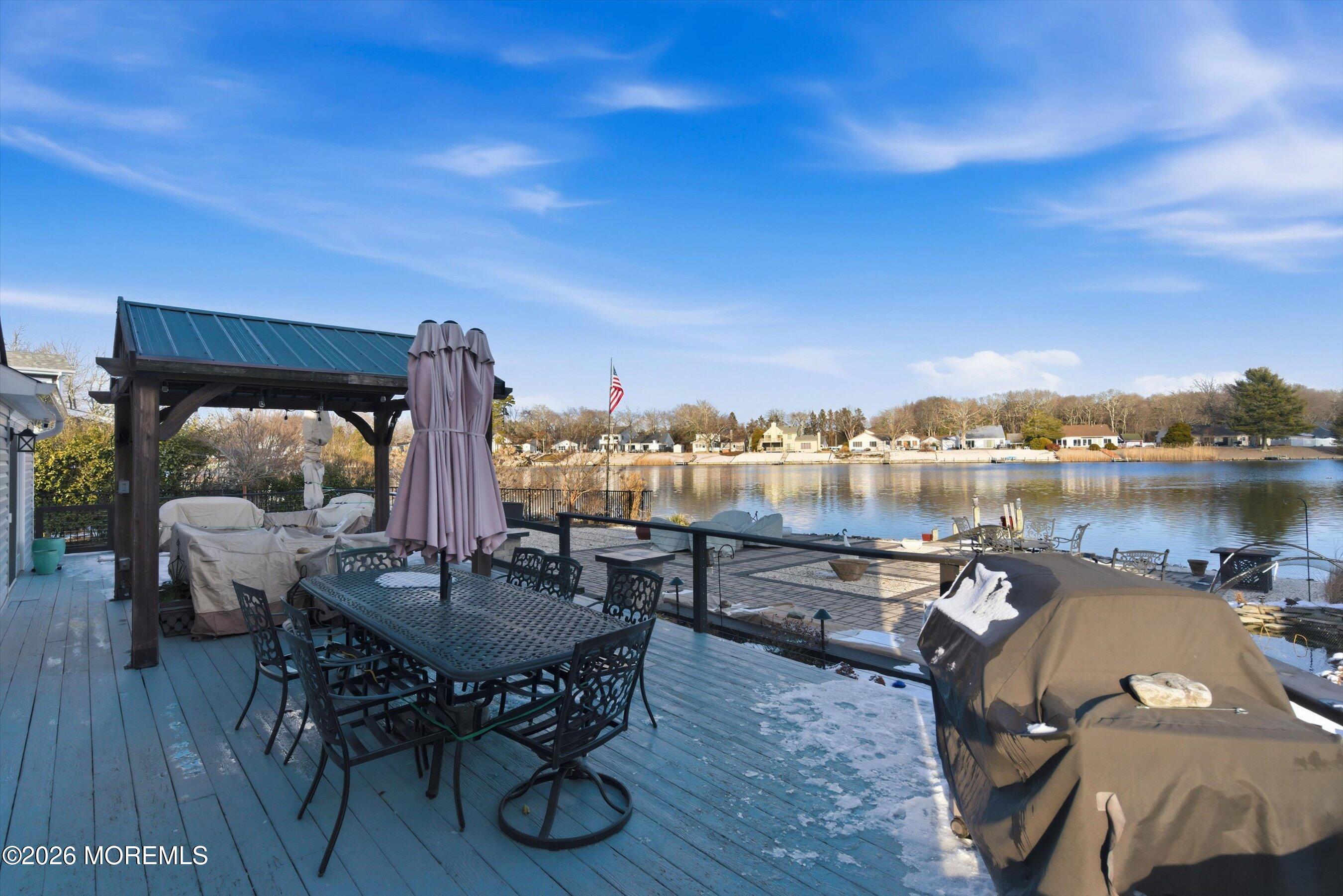 261 Timberlake Drive Manahawkin, NJ 08050 - Photo 38 of 64 a view of a chairs and table in the terrace