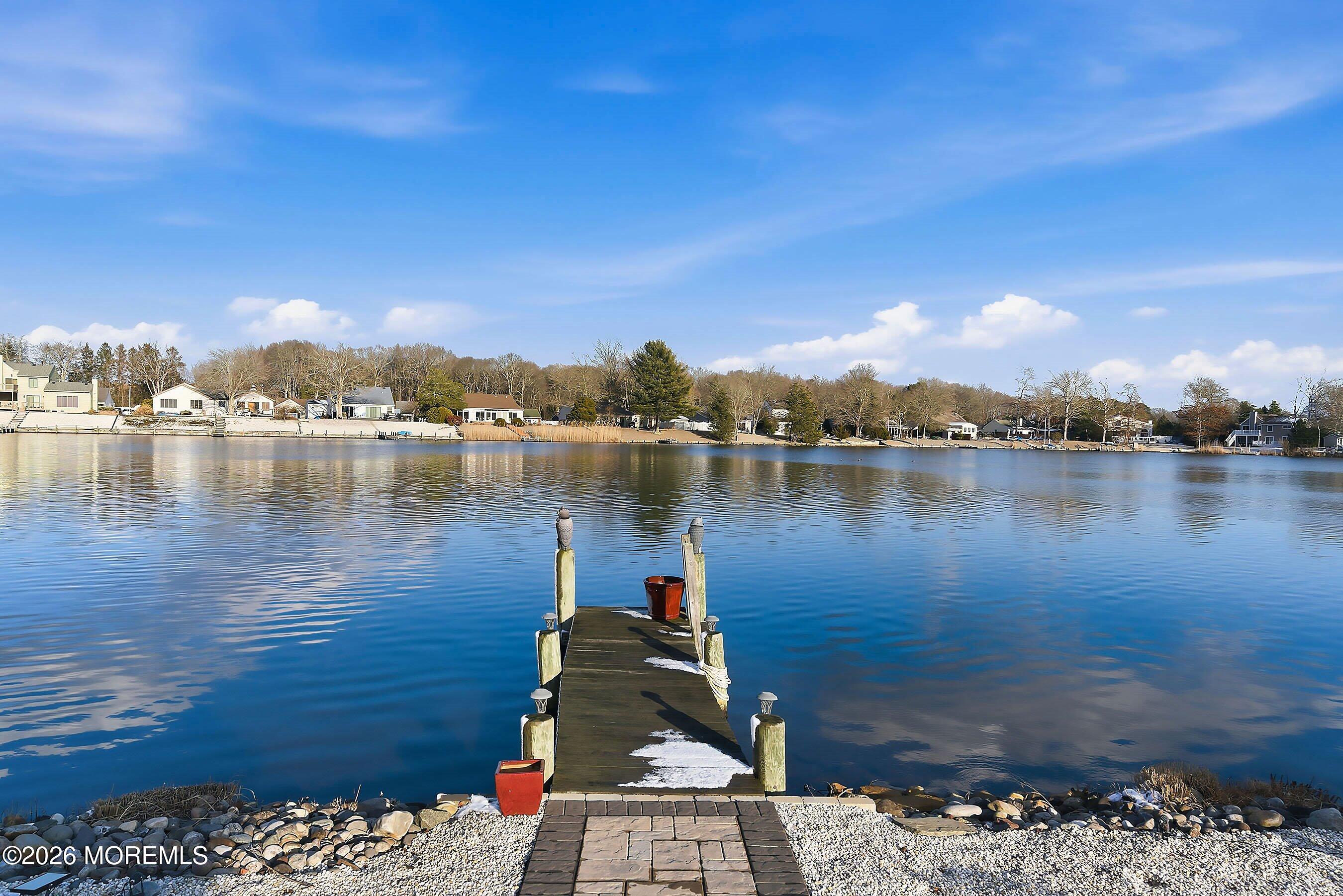 261 Timberlake Drive Manahawkin, NJ 08050 - Photo 41 of 64 a view of a lake with houses
