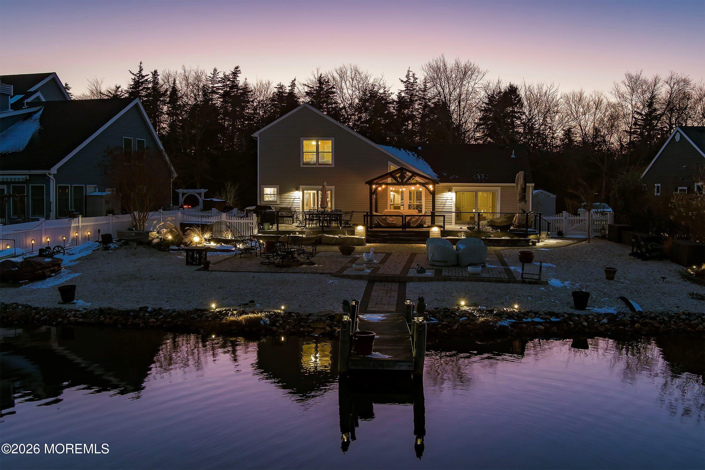 261 Timberlake Drive Manahawkin, NJ 08050 - Photo 6 of 64 a backyard of a house with table and chairs