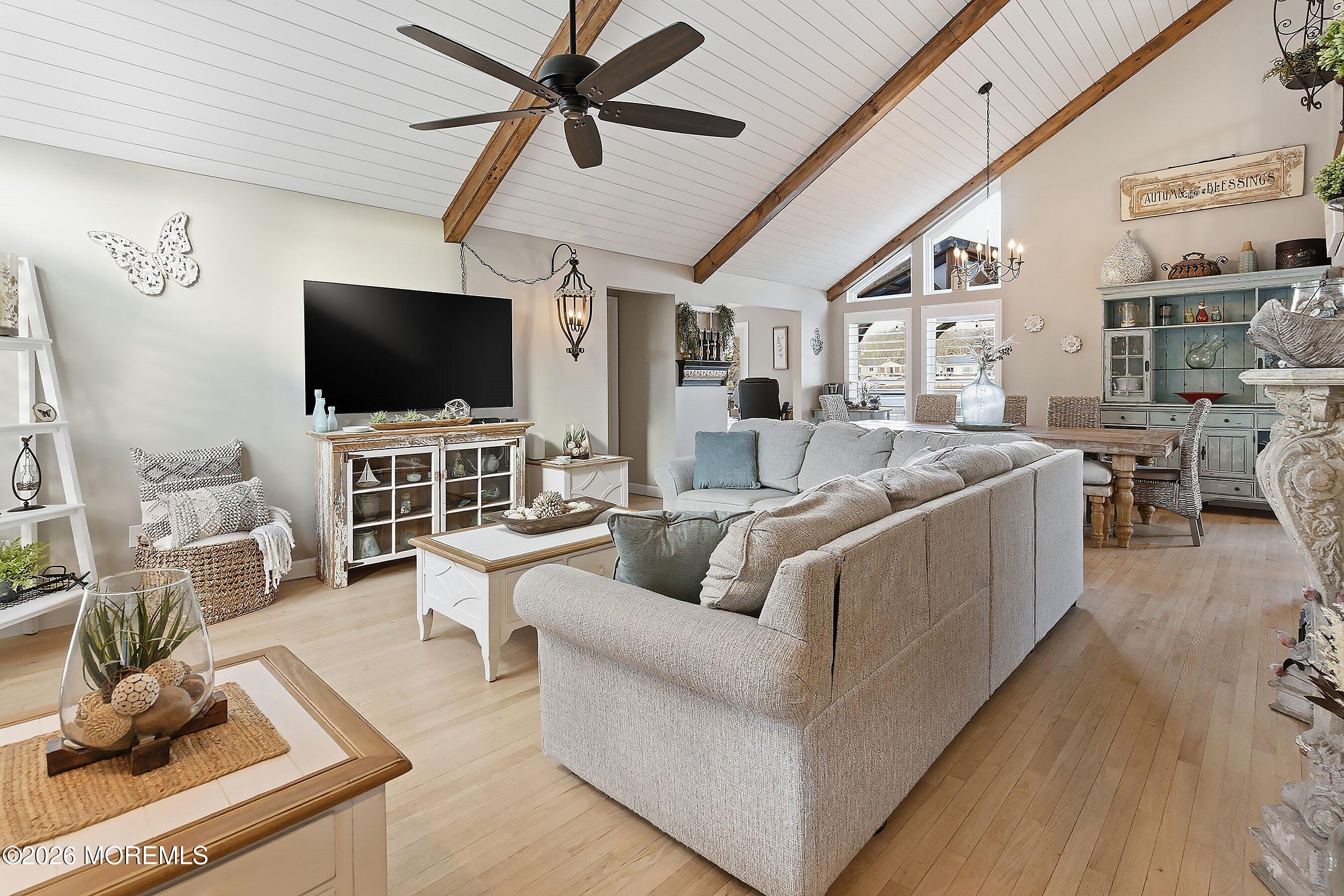 261 Timberlake Drive Manahawkin, NJ 08050 - Photo 9 of 64 a living room with furniture and a flat screen tv