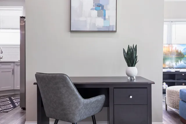 a workspace with furniture and window