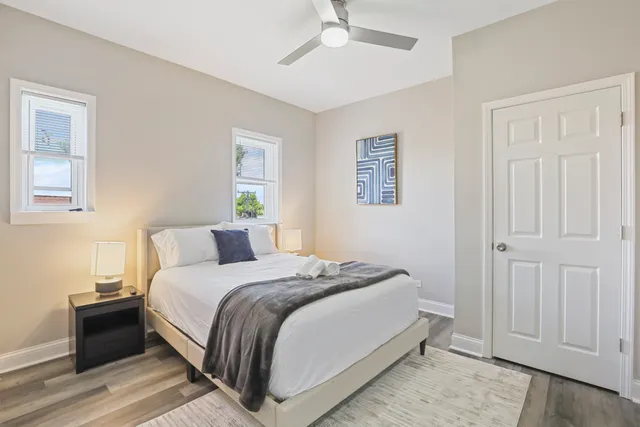 a bedroom with a bed and a window