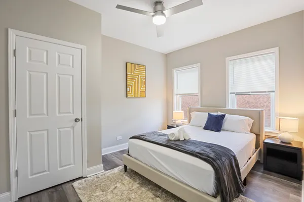 a bedroom with a bed and a window