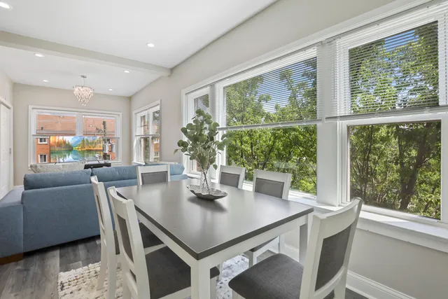 a view of a dining room with furniture window and outside view