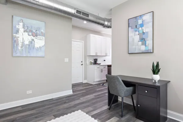 a view of a dining room with furniture and wooden floor