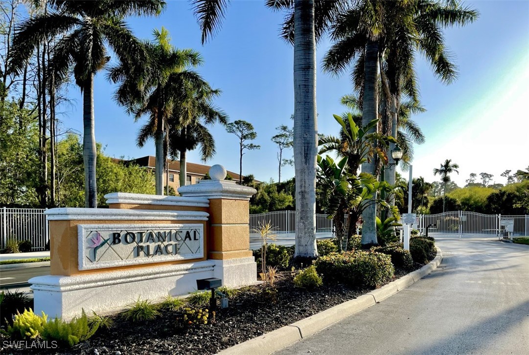 4440 Botanical Pl Circle, Unit 102 Naples, FL 34112 - Photo 1 of 21 a sign board with palm trees