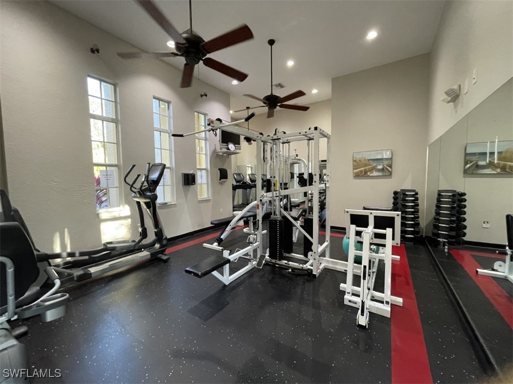 4440 Botanical Pl Circle, Unit 102 Naples, FL 34112 - Photo 19 of 21 a view of a room with gym equipment