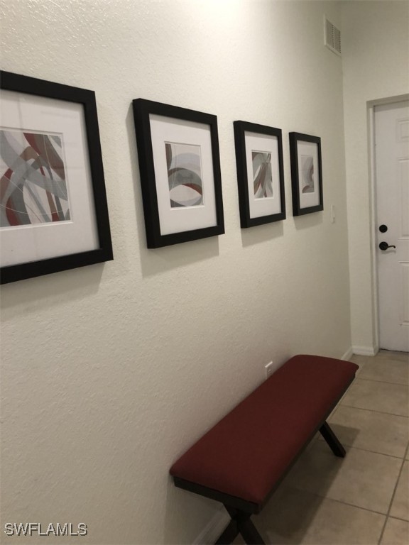 4440 Botanical Pl Circle, Unit 102 Naples, FL 34112 - Photo 2 of 21 a view of room with painting on the wall