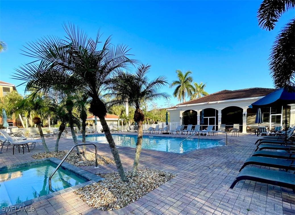 4440 Botanical Pl Circle, Unit 102 Naples, FL 34112 - Photo 21 of 21 a front view of a house with garden