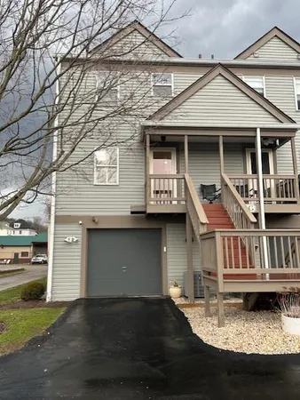 a front view of a house with yard