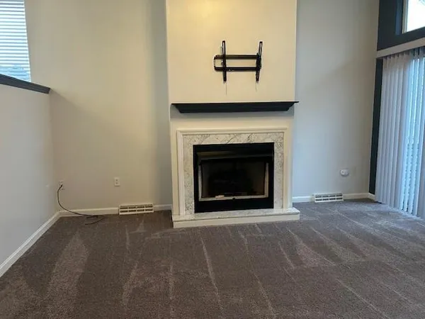a view of a livingroom with a fireplace