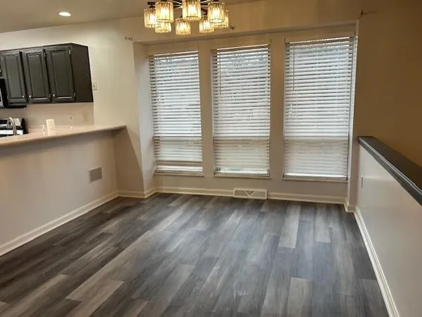 a kitchen with granite countertop a stove and a sink
