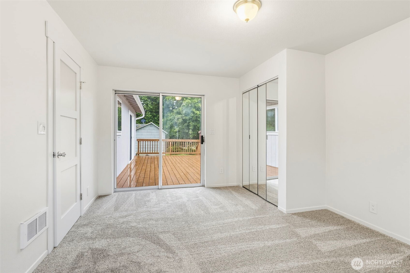 175 Jacobson Road Cathlamet, WA 98612 - Photo 27 of 32 a view of an empty room with wooden floor and a window