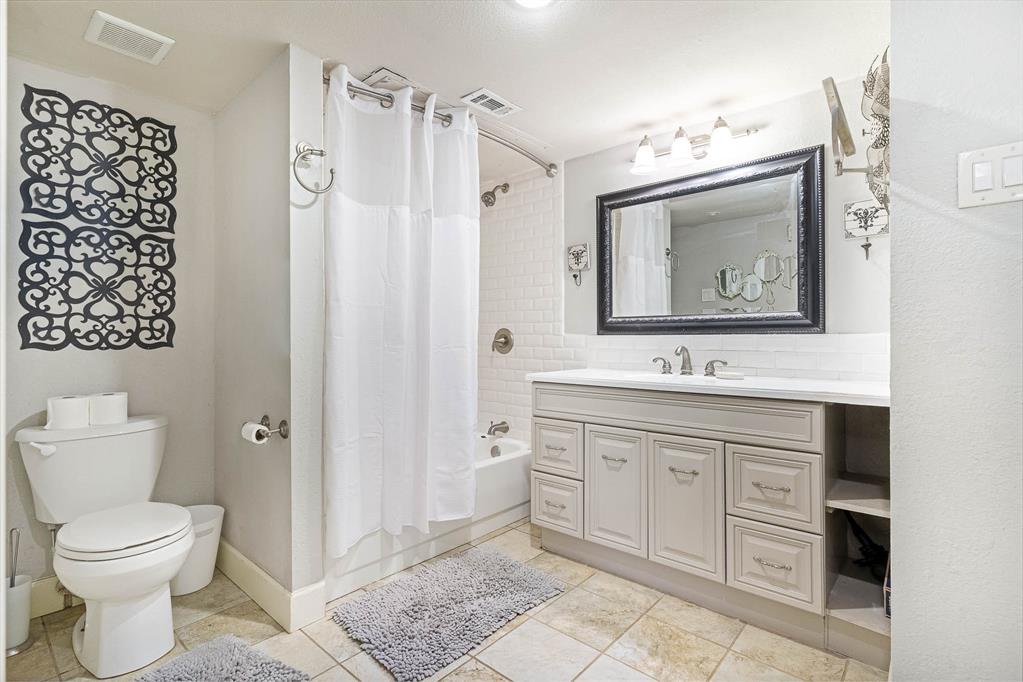 14277 Preston Road, Unit 221 Dallas, TX 75254 - Photo 3 of 8 Fresh, clean, and beautifully updated! This oversized bathroom features modern finishes, abundant storage, and a spacious vanity that makes busy mornings easy. Move right in and enjoy the updates without lifting a finger.