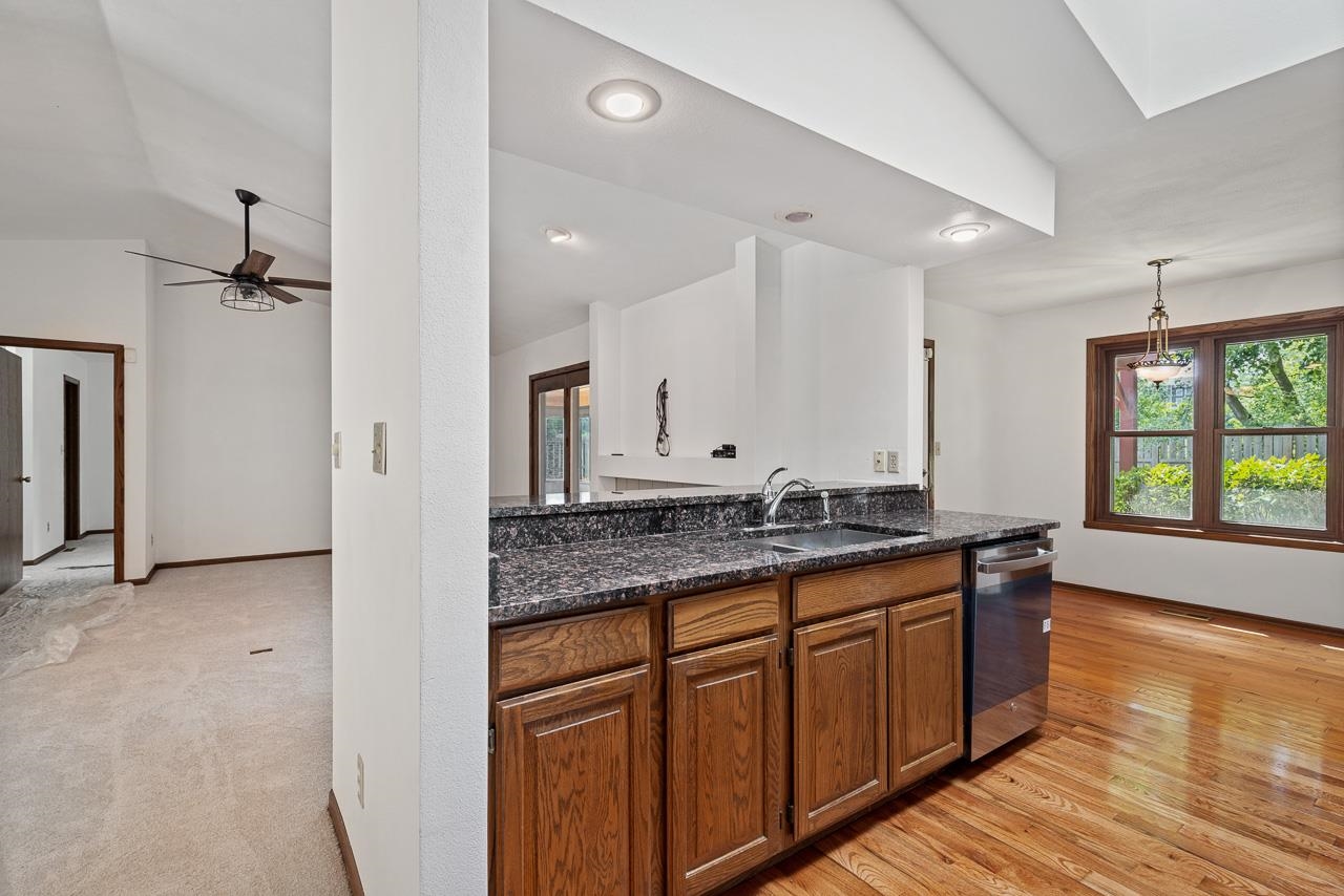 3442 North Trainer Road Rockford, IL 61114 - Photo 12 of 35 a bathroom with a granite countertop double vanity sink a mirror and a bathtub