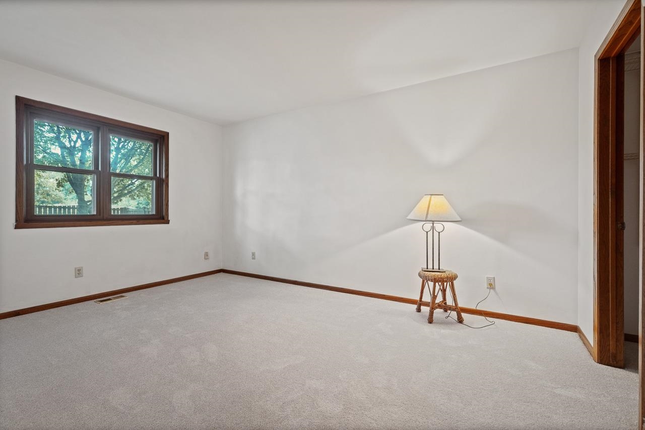 3442 North Trainer Road Rockford, IL 61114 - Photo 18 of 35 a view of a room with gym equipment and a window