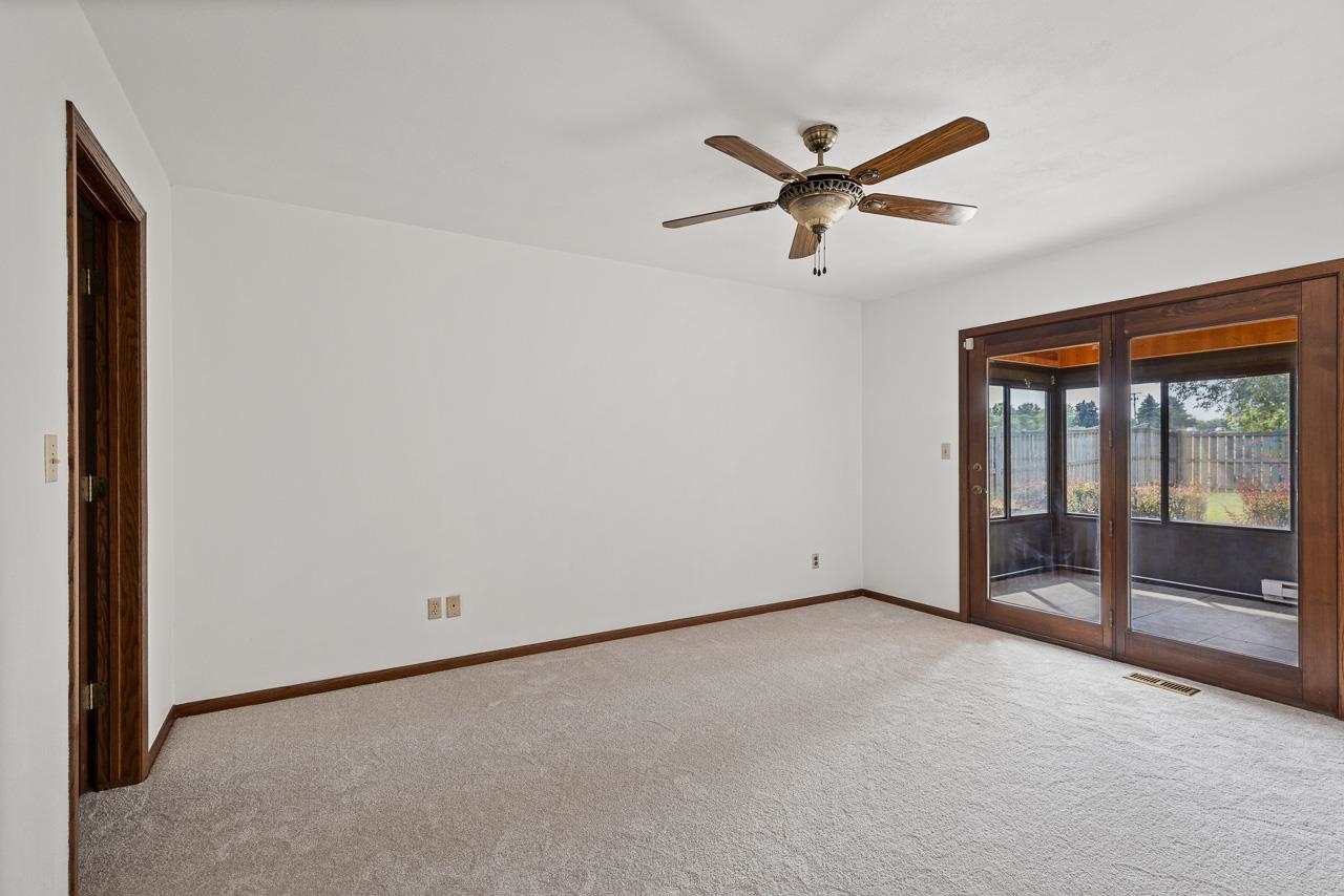 3442 North Trainer Road Rockford, IL 61114 - Photo 21 of 35 a view of a livingroom with a ceiling fan and window