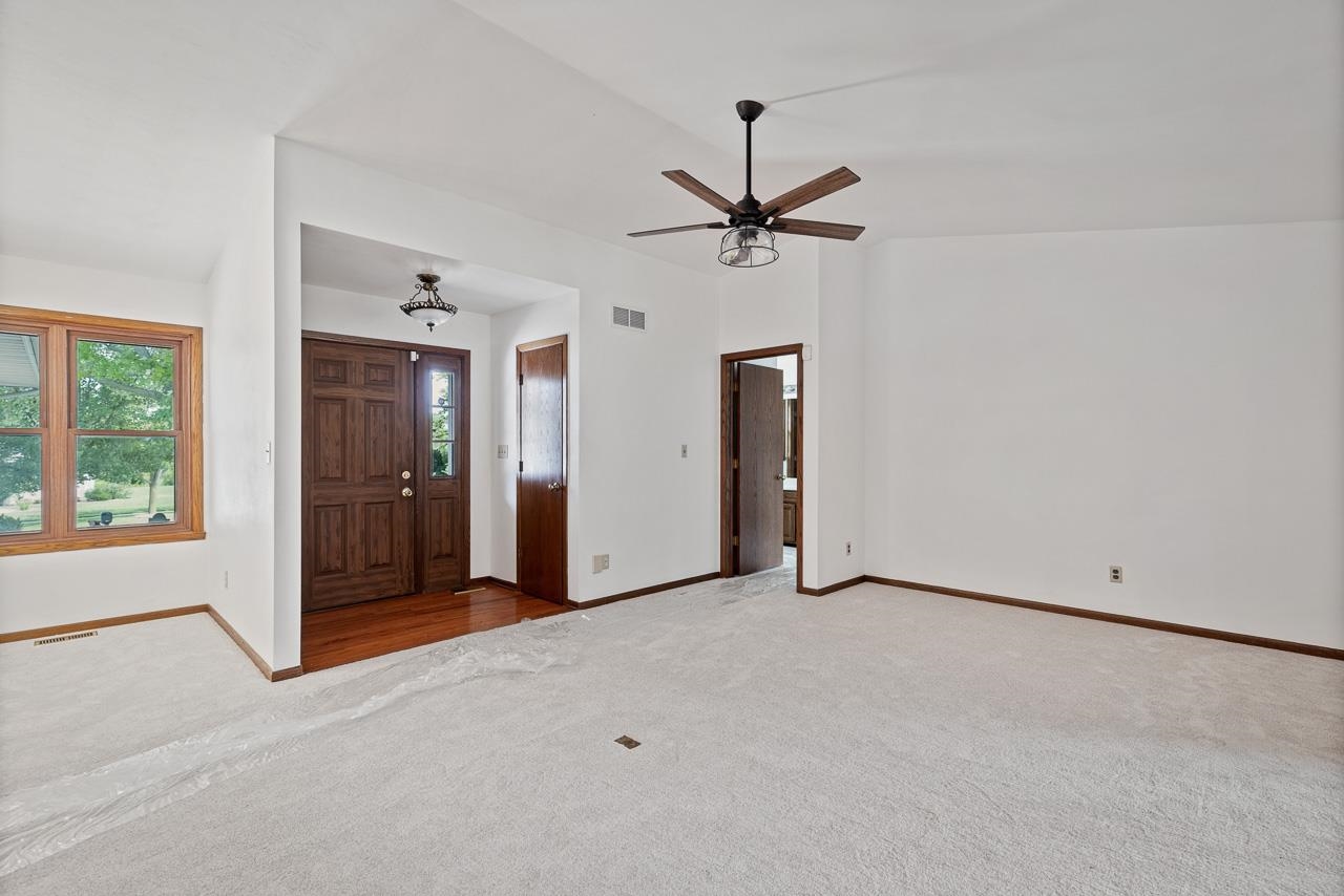 3442 North Trainer Road Rockford, IL 61114 - Photo 6 of 35 wooden floor in an empty room with a window