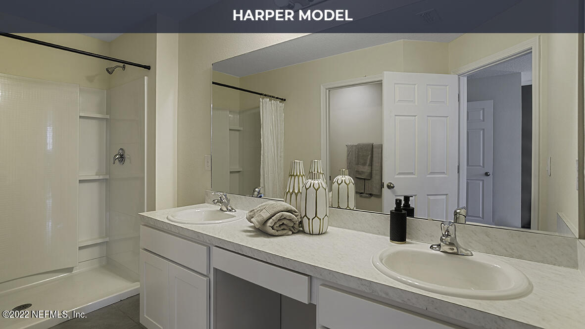 119 Java Lane St. Augustine, FL 32092 - Photo 10 of 31 a bathroom with a sink and a mirror