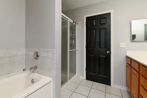 a bathroom with a bathtub and a shower