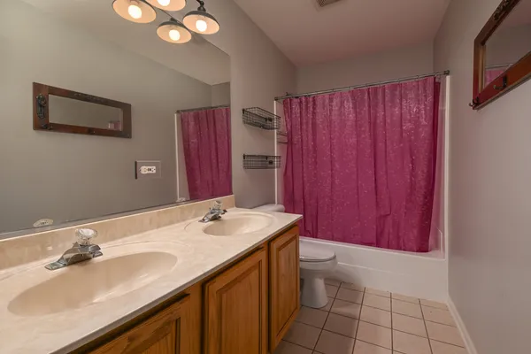 a bathroom with a sink a vanity and a mirror