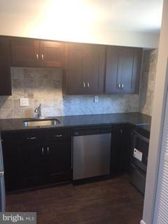 2065 Larkhall Road Baltimore, MD 21222 - Photo 3 of 6 a kitchen with a sink and cabinets