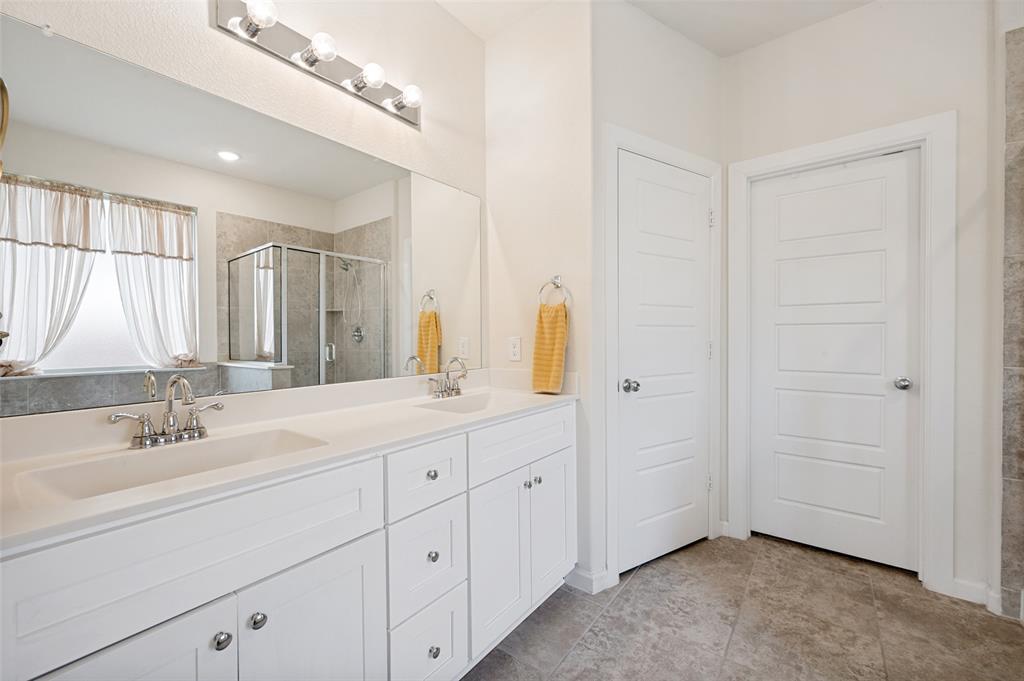 413 Wiggins Way Van Alstyne, TX 75495 - Photo 16 of 25 Dual vanity with integrated sinks and chrome fixtures