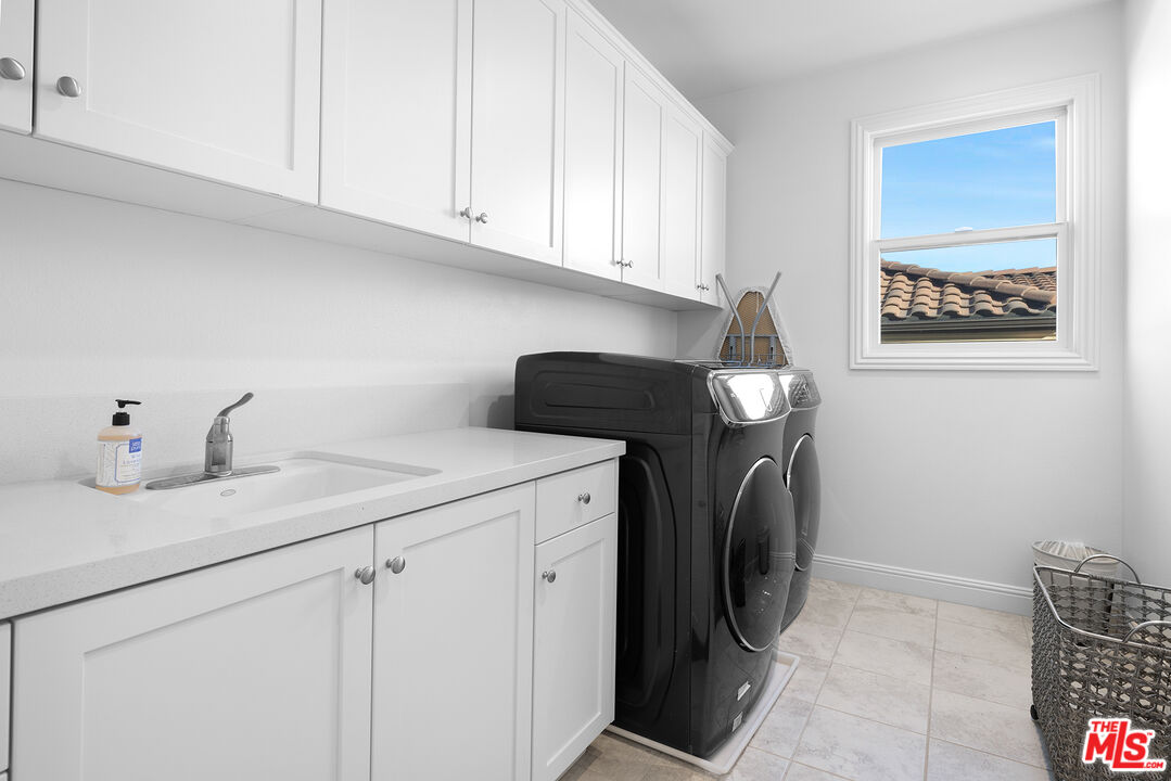 20234 Jubilee Way Porter Ranch, CA 91326 - Photo 29 of 30 a utility room with dryer and washer