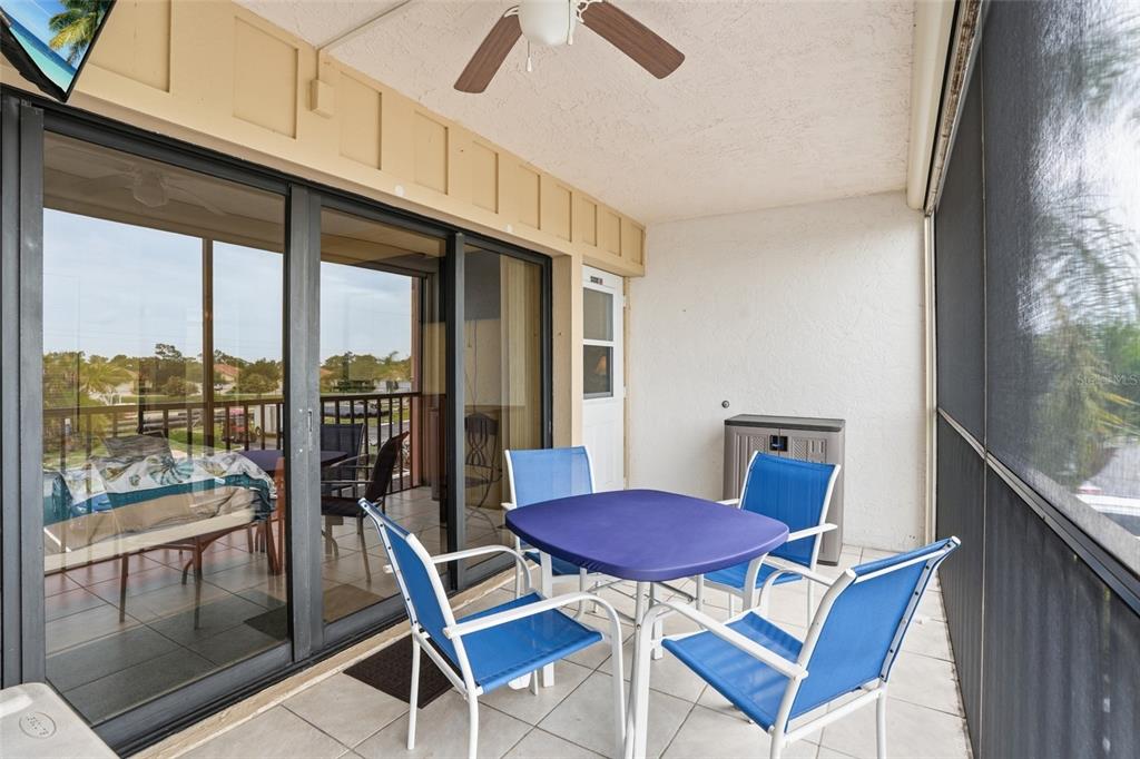 3170 Matecumbe Key Road, Unit 127 Punta Gorda, FL 33955 - Photo 18 of 22 a view of a dining room with furniture window and outside view
