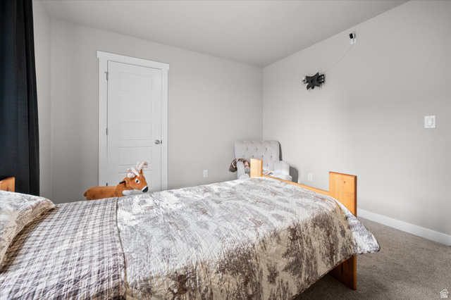 3359 Eurasian Crane Road Clinton, UT 84015 - Photo 31 of 71 Bedroom featuring carpet floors and baseboards