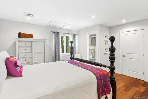 a view of a dining room with furniture a chandelier and wooden floor