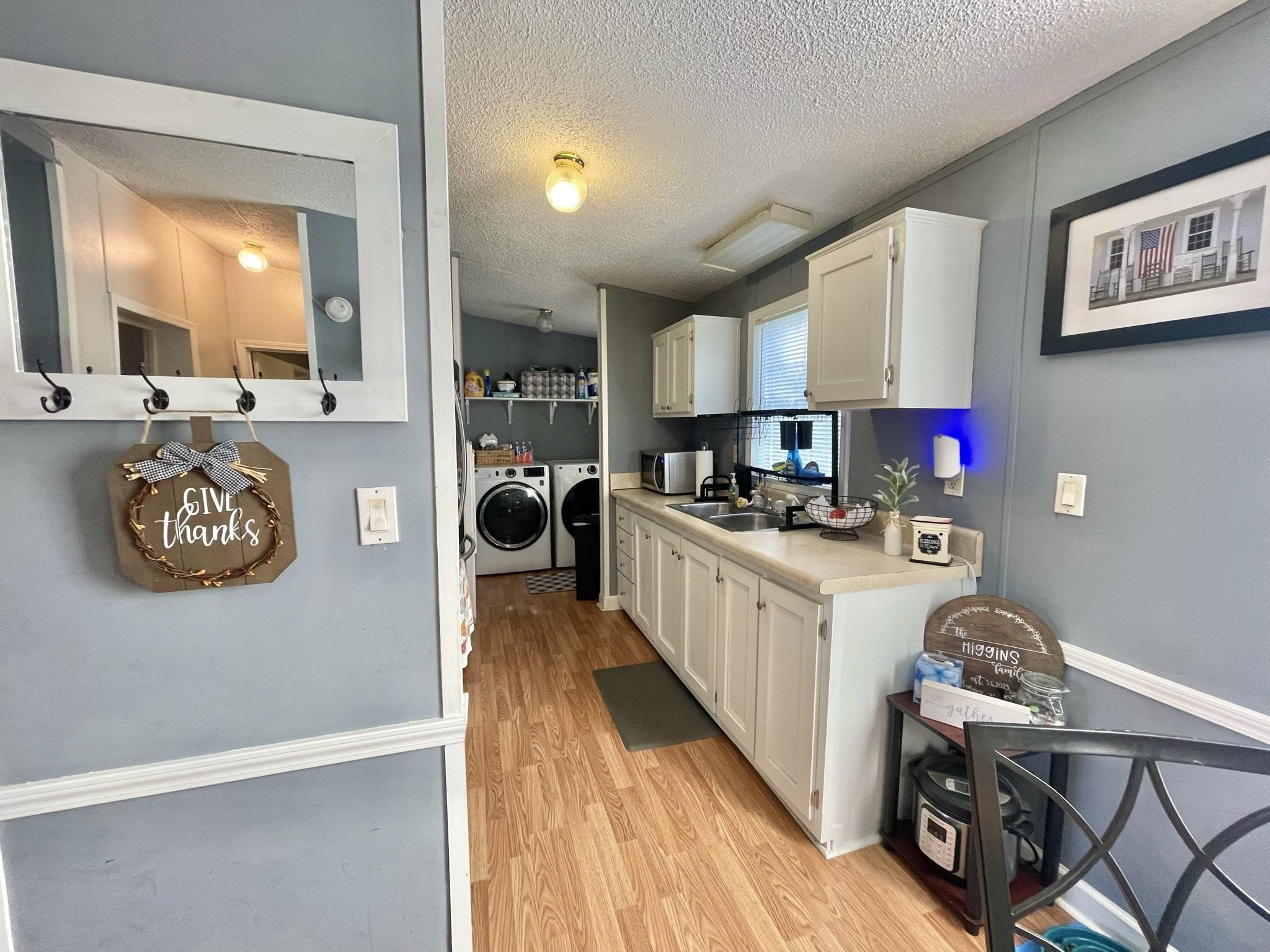 2433 Shiloh Church Road Roxboro, NC 27574 - Photo 6 of 26 a kitchen with stainless steel appliances granite countertop a refrigerator and a stove top oven