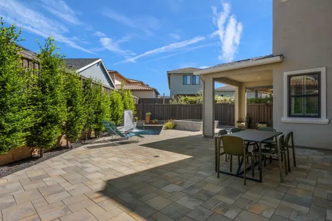 a view of backyard with outdoor seating