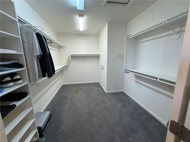 a kitchen with granite countertop a refrigerator and a stove
