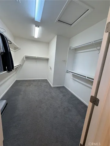 a bedroom with two beds and window