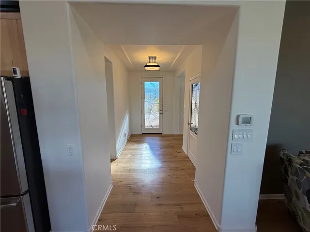 a kitchen with kitchen island granite countertop a sink a counter top space and cabinets