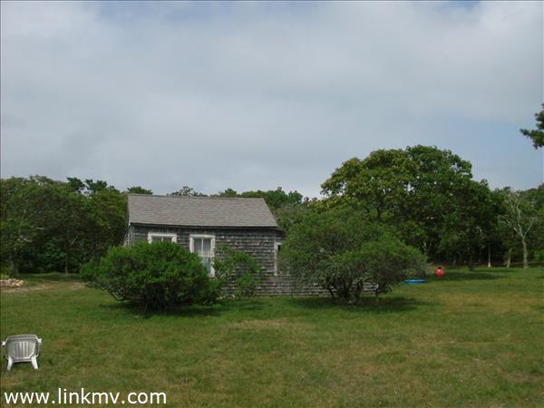 11 Quammox Road Edgartown, MA 02539 - Photo 2 of 2 a view of a house with a yard