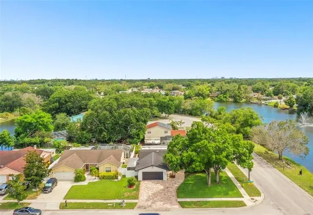 a view of houses with outdoor space and swimming pool