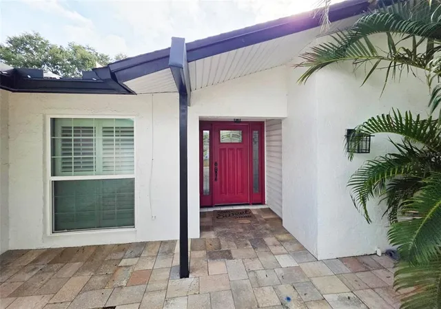 a view of a entryway door front of a house